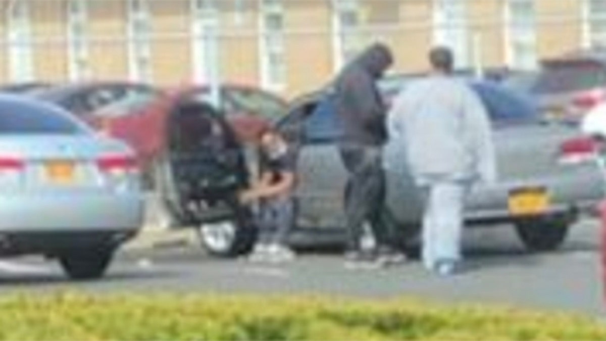 Surveillance photos of Kotarra Jackson in grey sweats that prosecutors said showed the Bloods gang member disobeying social distancing restrictions after winning coronavirus "compassionate release" from a federal lockup.