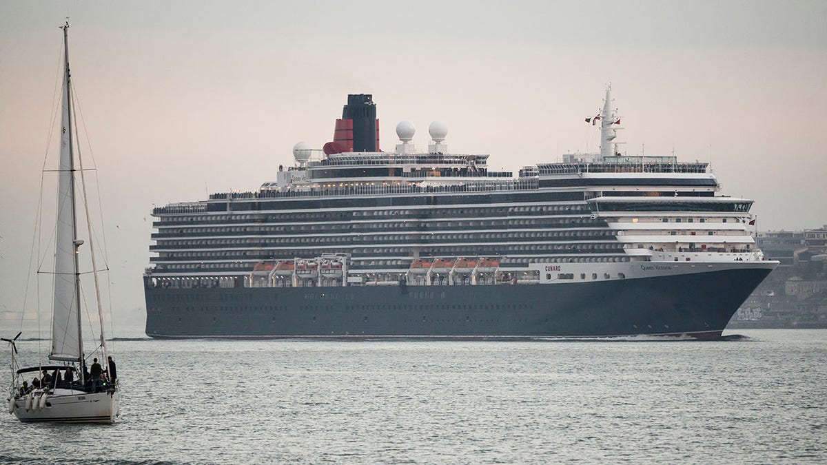 The MS Queen Victoria, seen here in January, outside of Lisbon, Portugal, is one of the three Cunard Cruises ships that will remain non-operational through the end of summer. Cunard is one of several other cruise lines, some of which are owned by Carnival and Norwegian, to recently extended its voluntary suspension of operations.