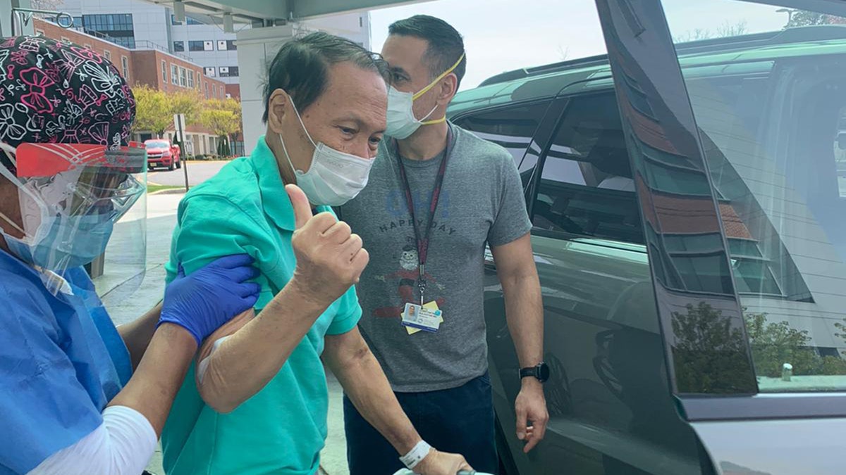 On the day of discharge, Dr. Bulauitan insisted on "walking the last few steps" to his car. He is assisted by his oldest son Major Dr. Constantine Bulauitan of the United States Army.