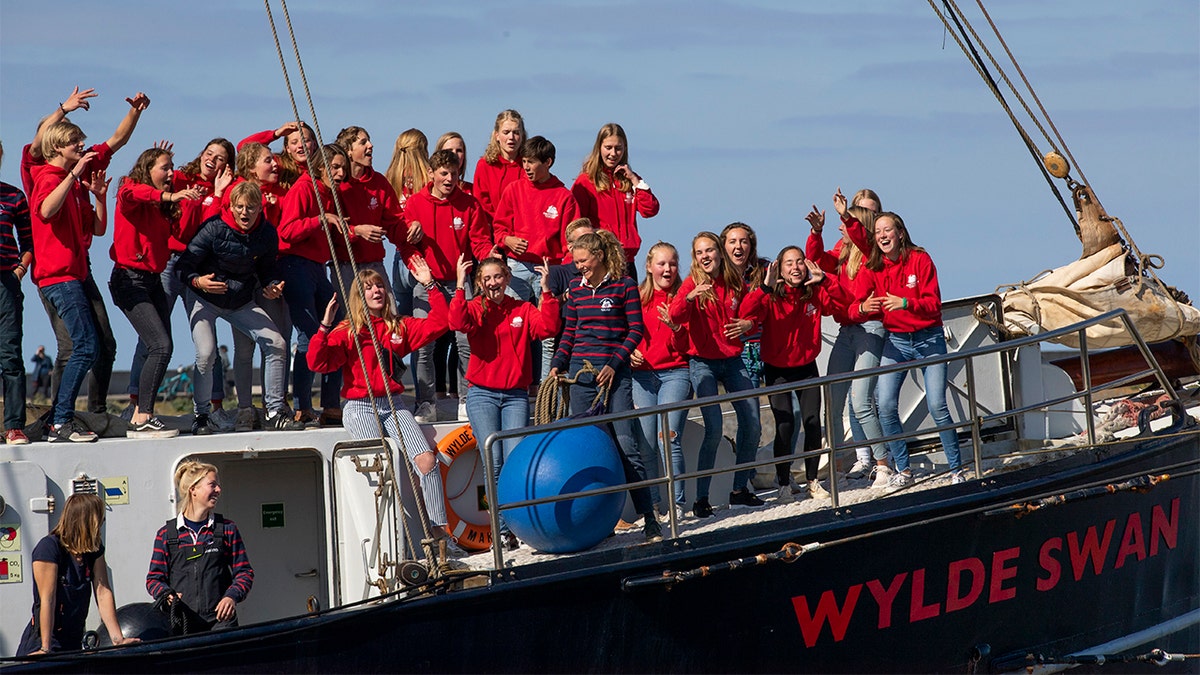 The arriving teenagers were all smiles. (AP Photo/Peter Dejong)