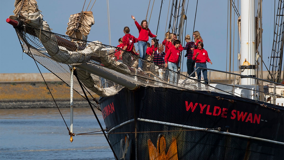 Dutch teens cheering on their schooner, Wylde Swan, after sailing home from the Caribbean across the Atlantic. (AP Photo/Peter Dejong)