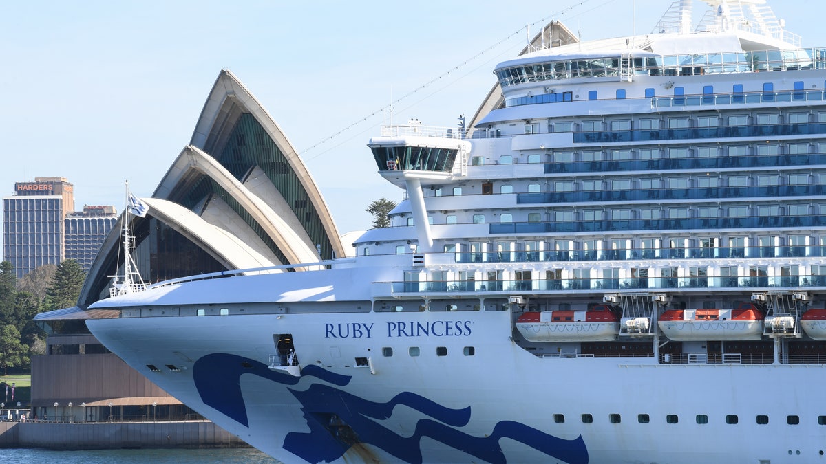 The Ruby Princess departs Sydney Harbour with no passengers and only crew on board as it passes the Opera House on March 19. (James D. Morgan/Getty Images)