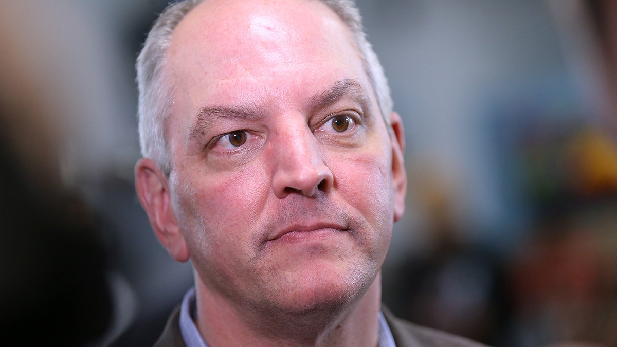 Gov. John Bel Edwards talks to media at the Case Closed Barbershop on November 15, 2019 in New Orleans, Louisiana.