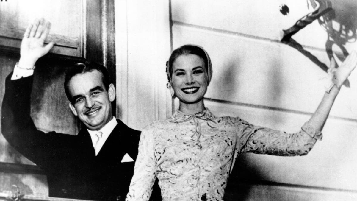 Prince Rainier III and actress Princess Grace Kelly wave from the palace terrace at Monaco in the South of France on April 18, 1956.(AP Photo)