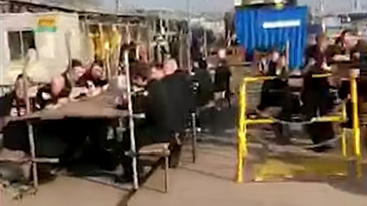 Video shared by Forces Compare showed HMS Trenchant sailors eating and listening to music while sitting on the dock after their submarine came ashore.