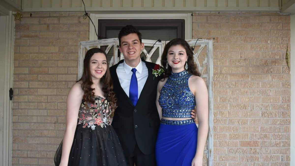 Grayson, left, is pictured with siblings Crae and Maura Chapman.