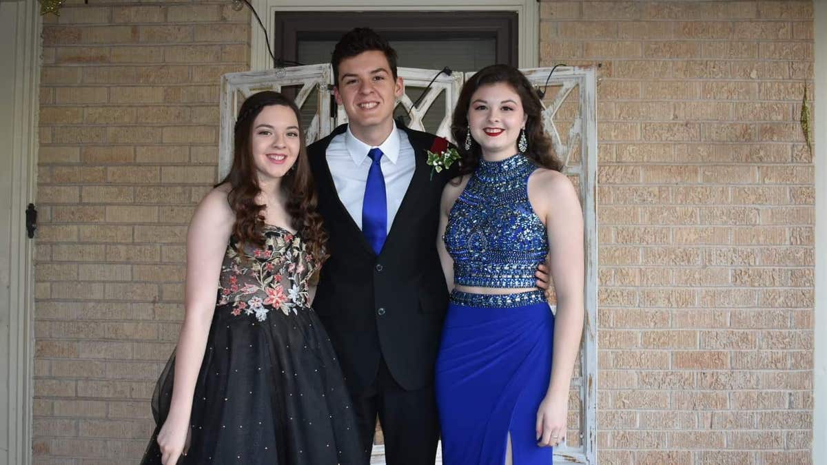 Grayson, left, is pictured with siblings Crae and Maura Chapman.