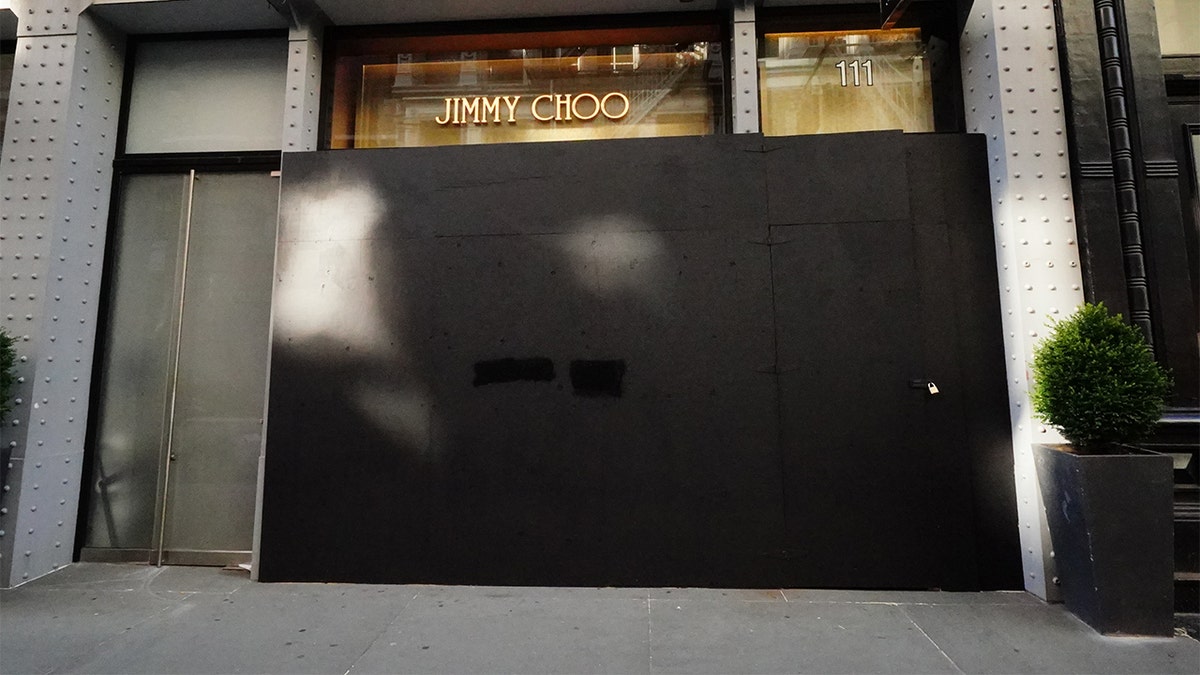 A view of a Jimmy Choo Boutique in Soho area boarded shut amid the coronavirus (COVID-19) outbreak on March 26, 2020 in New York City 