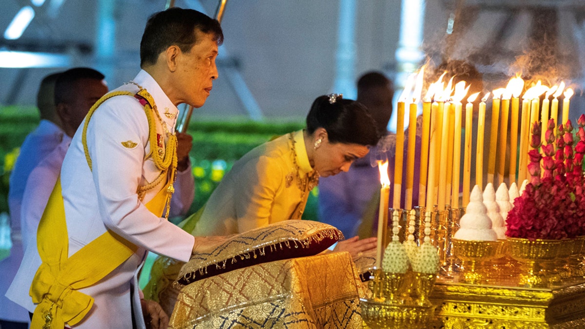 Thailand's King Maha Vajiralongkorn and Queen Suthida, one of his wives, pay their respects at the King Rama I monument on April 6 to honor the start of the Chakri dynasty's reign in Bangkok, Thailand.