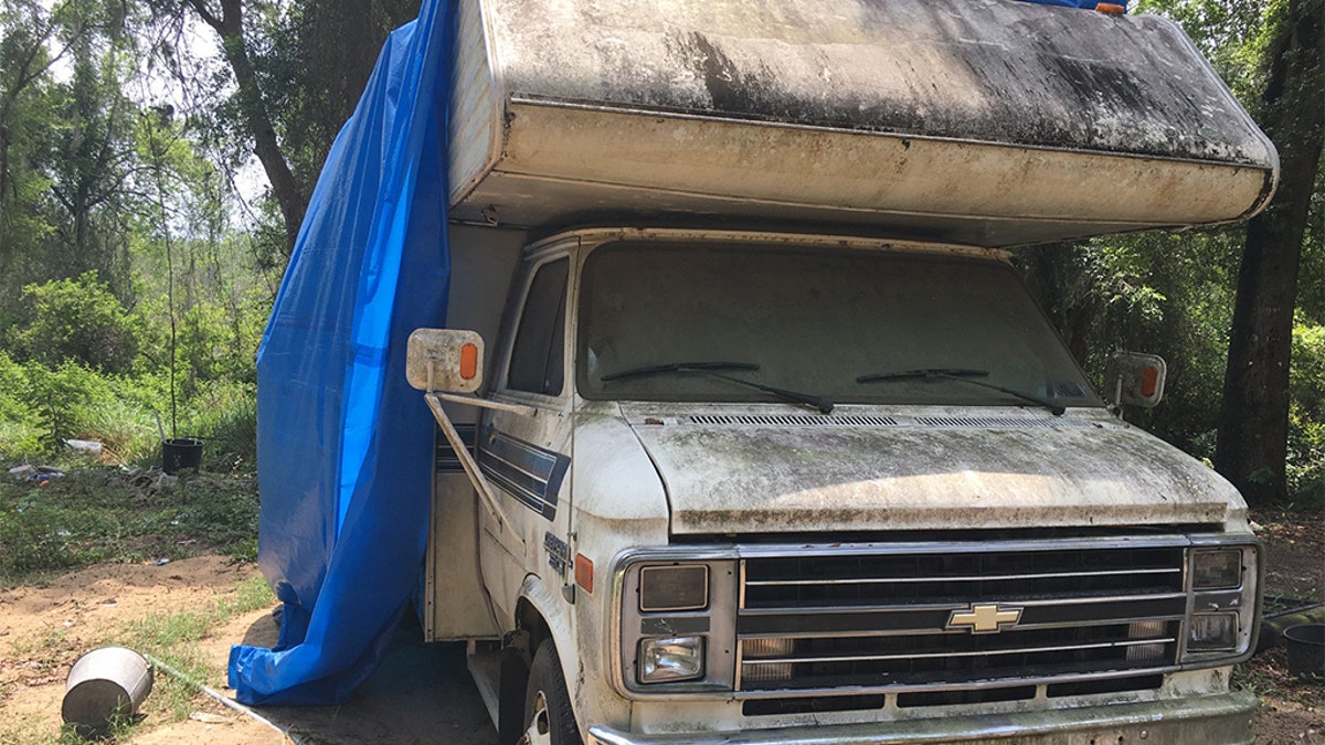 The victim was allegedly forced to imbibe an unknown substance and brought to a camper parked at the back of a Florida property, police said. (Courtesy: Marion County Sheriff’s Office)