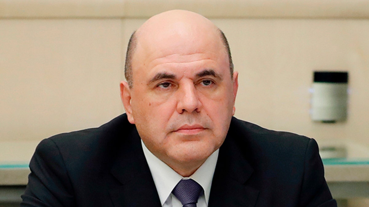In this pool photo taken on Tuesday, April 28, 2020, Russian Prime Minister Mikhail Mishustin attends a meeting with Russian President Vladimir Putin and a cabinet via teleconference in Moscow, Russia. Russian Prime Minister Mikhail Mishustin says he has tested positive for the new coronavirus and has told President Vladimir Putin he will self-isolate. (Dmitry Astakhov, Sputnik, Kremlin Pool Photo via AP)