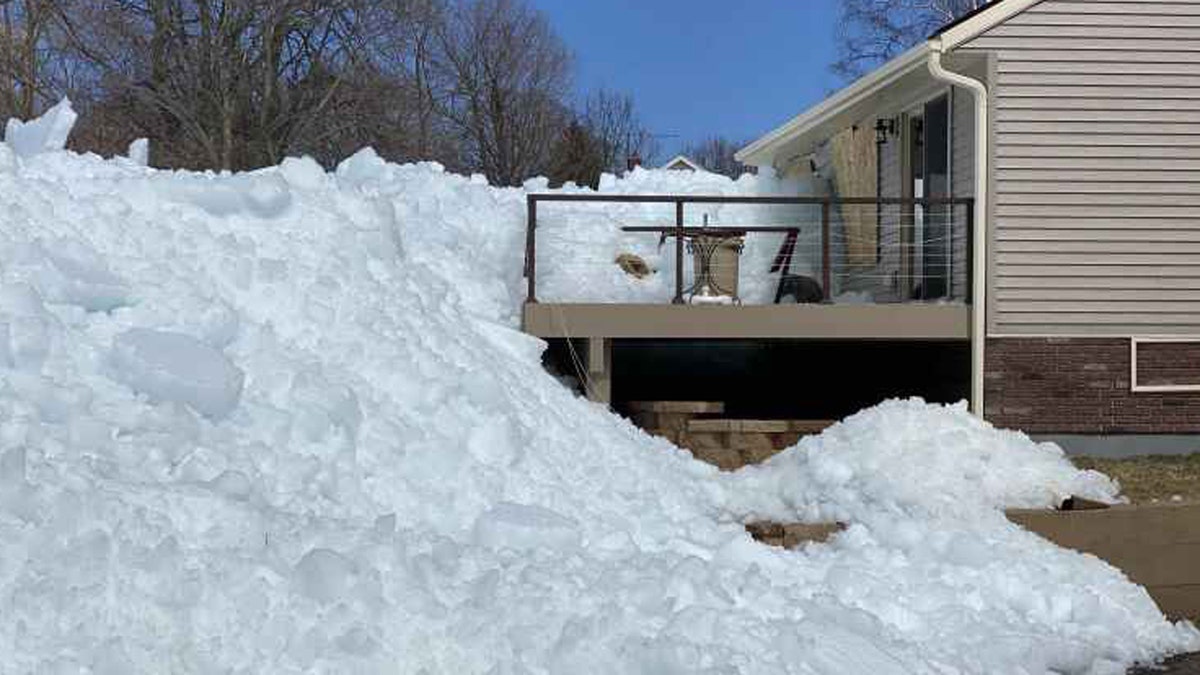 The occurrence is a result of heavy winds pushing leftover ice into piles on lakefront areas, threatening damage to some homes.
