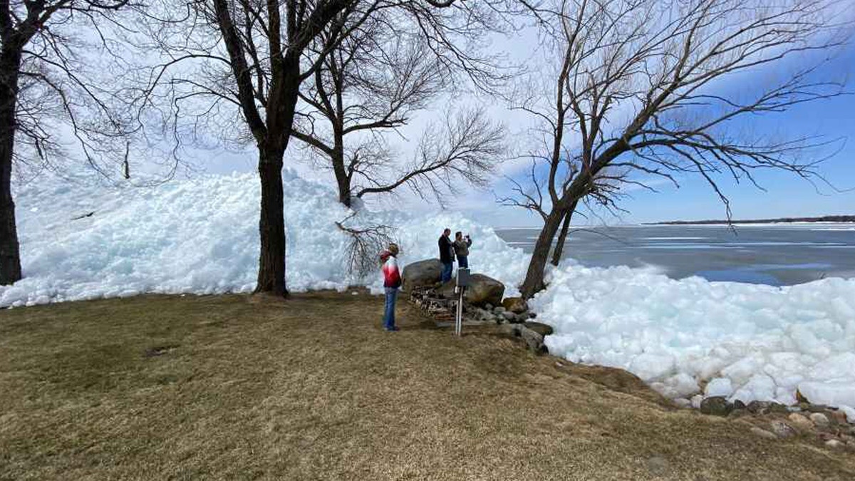 The occurrence is a result of heavy winds pushing leftover ice into piles on lakefront areas.