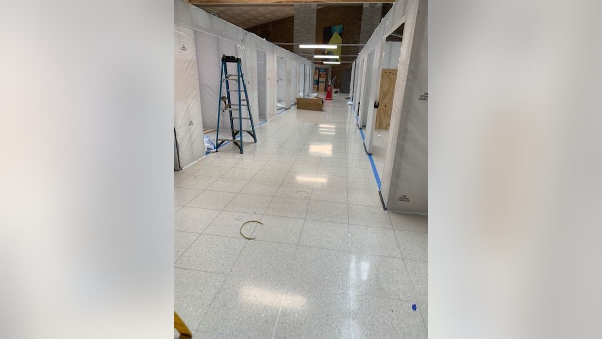 In the lobby of The Mount Sinai Hospital on Manhattan's Upper East Side (pictured above), officials are building additional rooms to handle an overflow of COVID-19 patients.