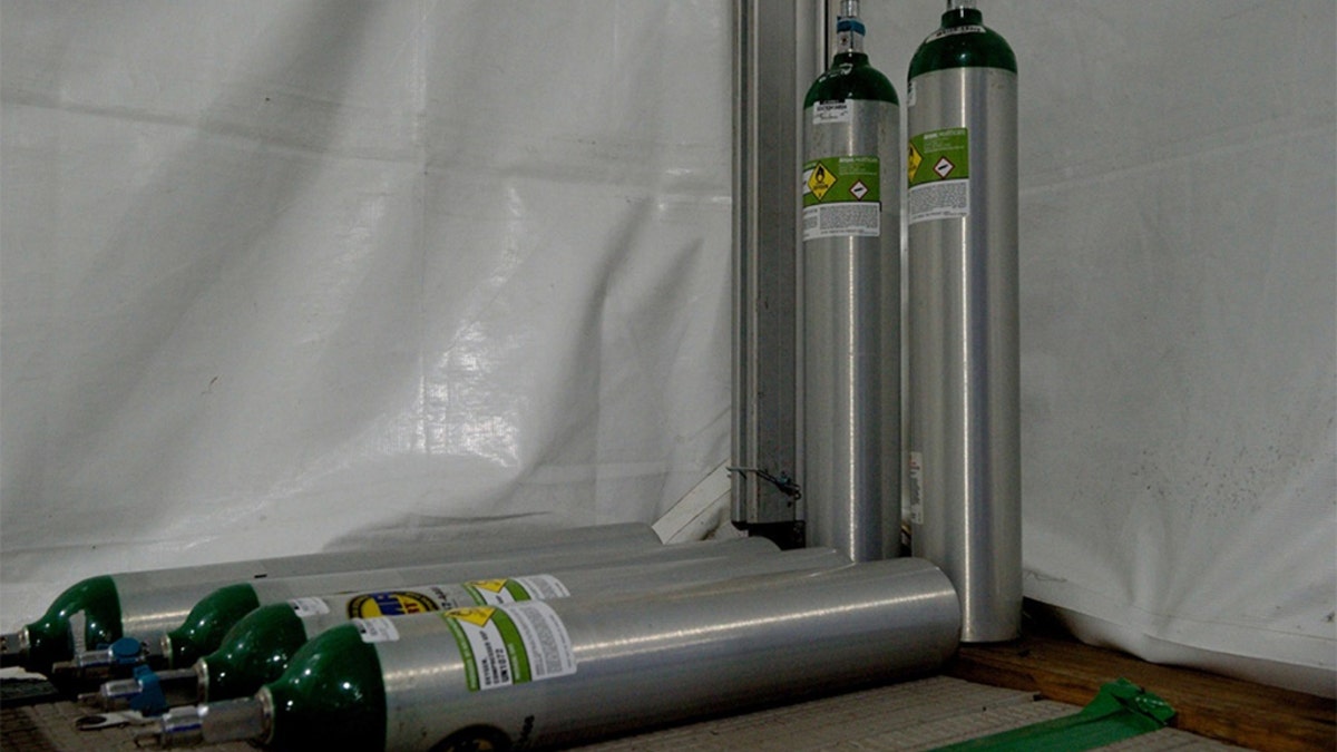 Medical grade oxygen tanks utilized by the patient transport team aboard the USNS Comfor hospital ship. (U.S. Navy photo by Ensign James Caliva)