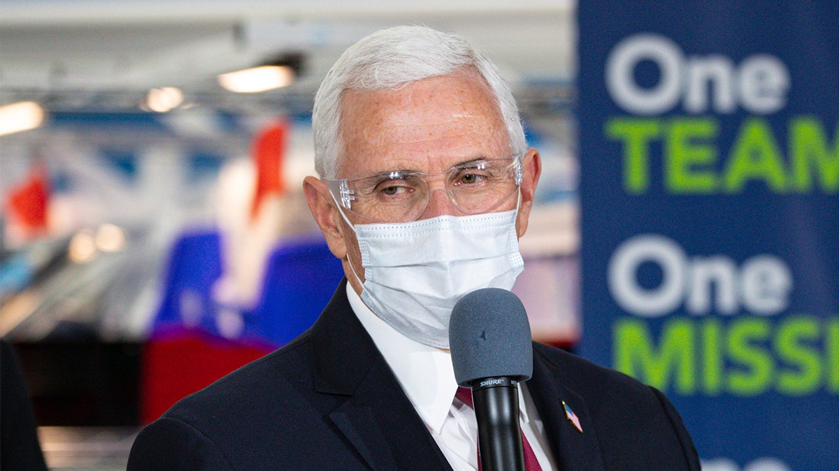 Vice President Mike Pence speaks during a visit to the General Motors/Ventec ventilator production facility with Indiana Gov. Eric Holcomb in Kokomo, Ind., Thursday, April 30, 2020. (AP Photo/Michael Conroy)