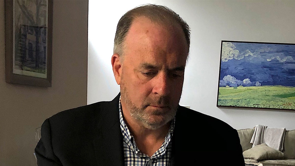 "I have been working from home in Michigan for the last three weeks, except for when I drove to Washington, D.C. to vote for the third emergency relief bill that recently passed Congress," says Rep. Dan Kildee, D-Mich., in a photo working from home.