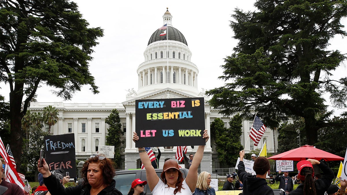 FILE - In this Monday, April 20, 2020, file photo, protesters calling for an end of Gov. Gavin Newsom's stay-at-home orders rally at the state Capitol in Sacramento, Calif. (AP Photo/Rich Pedroncelli, File)