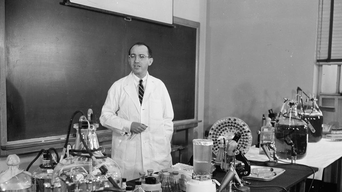 FILE - In this April 8, 1955 file photo, Dr. Jonas Salk, developer of the polio vaccine, describes how the vaccine is made and tested in his laboratory at the University of Pittsburgh. (AP Photo)