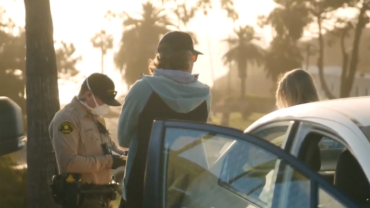 Tickets were issued to 22 people who were "watching the sunset, having picnics near the beach" in Encinitas, Calif. on Friday, according to officials.