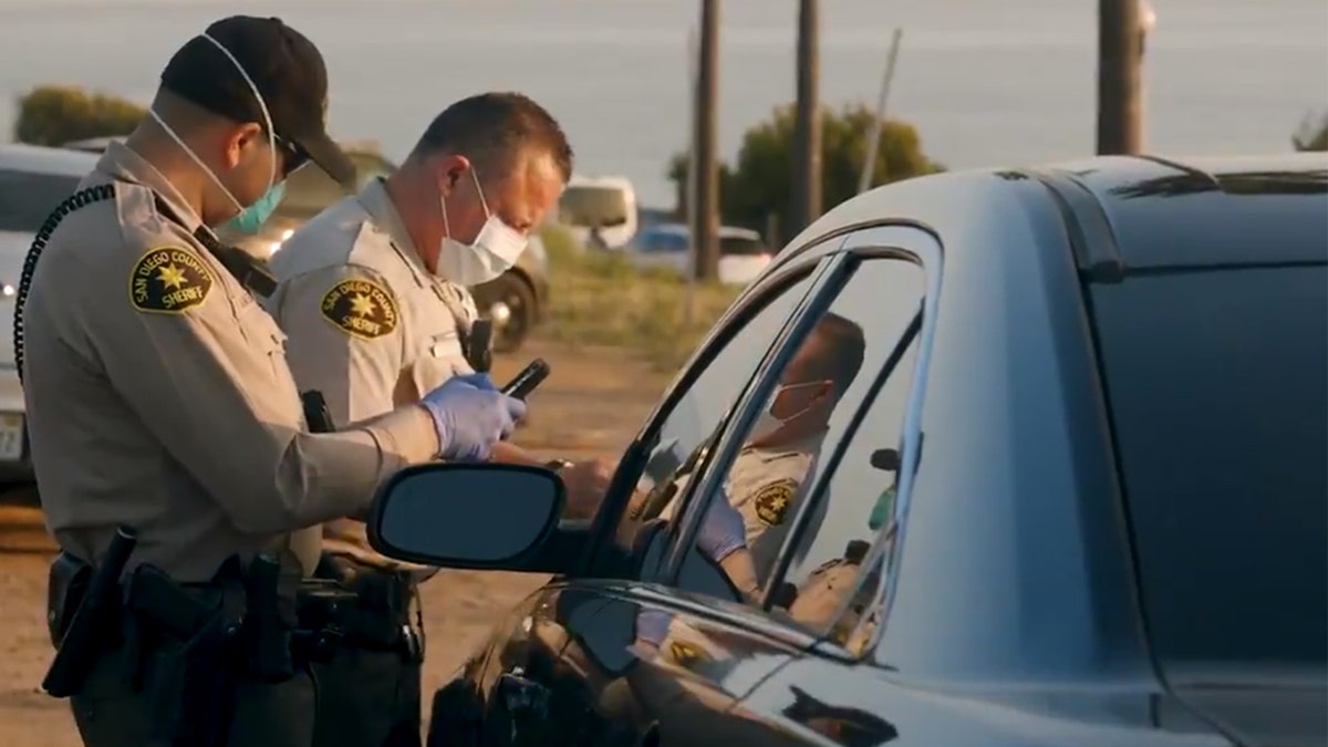Tickets were issued to 22 people who were "watching the sunset, having picnics near the beach" in Encinitas, Calif. on Friday, according to officials.