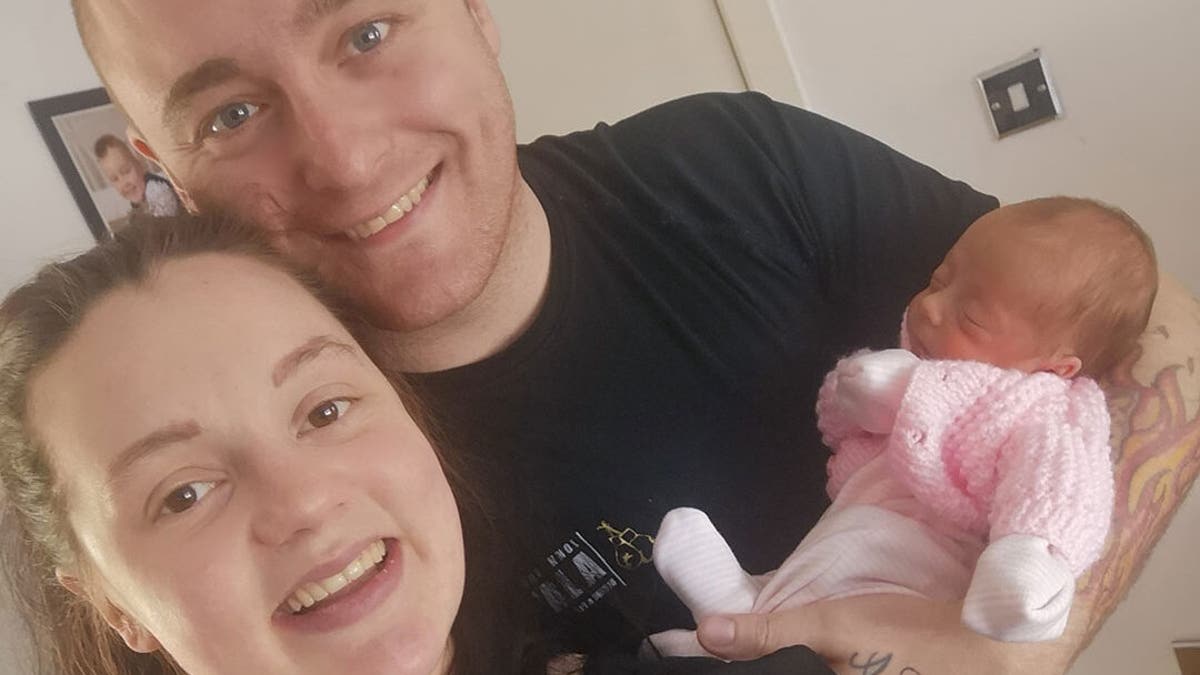 Baby Peyton with her parents.