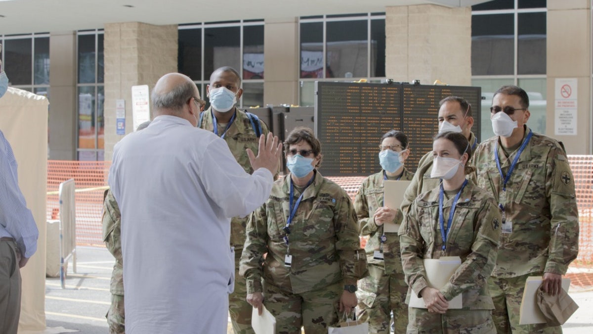 Dr. Mark Einstein (left) of University Hospital giving a tour.