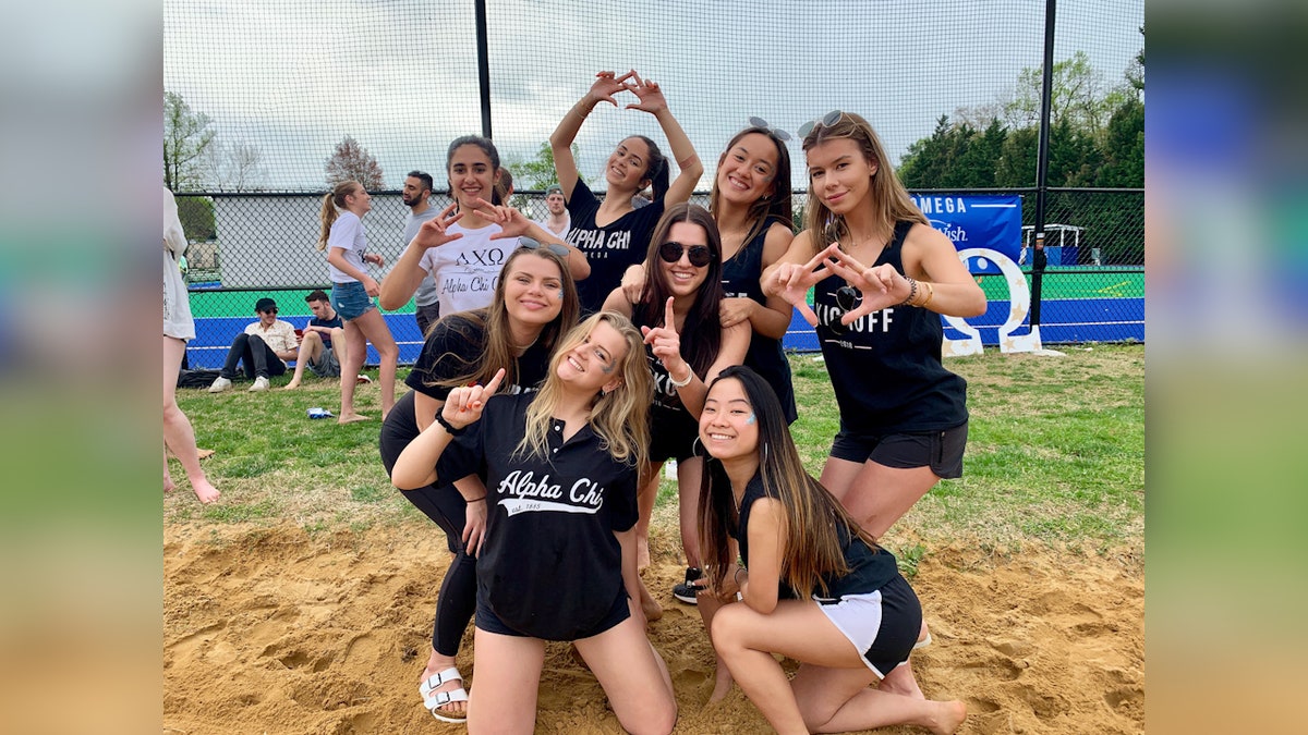 Penny Kmitt poses alongside her Alpha Chi Omega sorority sisters during a soccer kickoff charity event at American University. 