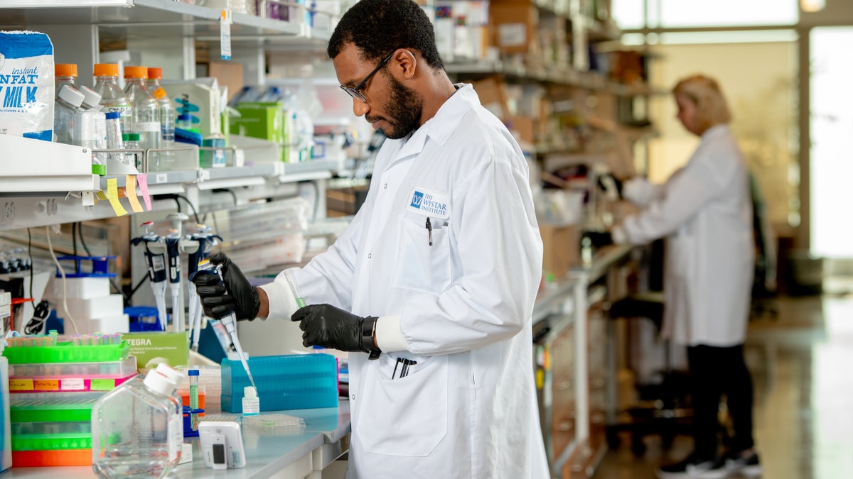 Scientists in the lab of Dr. David Weiner test synthetic DNA technology to fine tune synthetic vaccine candidates, prior to COVID-19 pandemic.