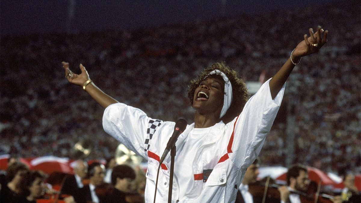 Whitney Houston sings the National Anthem before a game with the New York Giants taking on the Buffalo Bills prior to Super Bowl XXV at Tampa Stadium on January 27, 1991, in Tampa, Fla. 