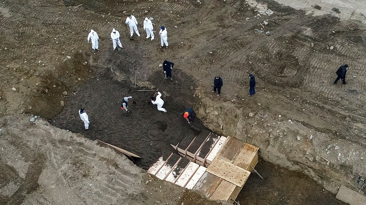 New York City’s medical examiner says the city will hold onto remains for 14 days before they will be transferred to Hart Island. (AP)