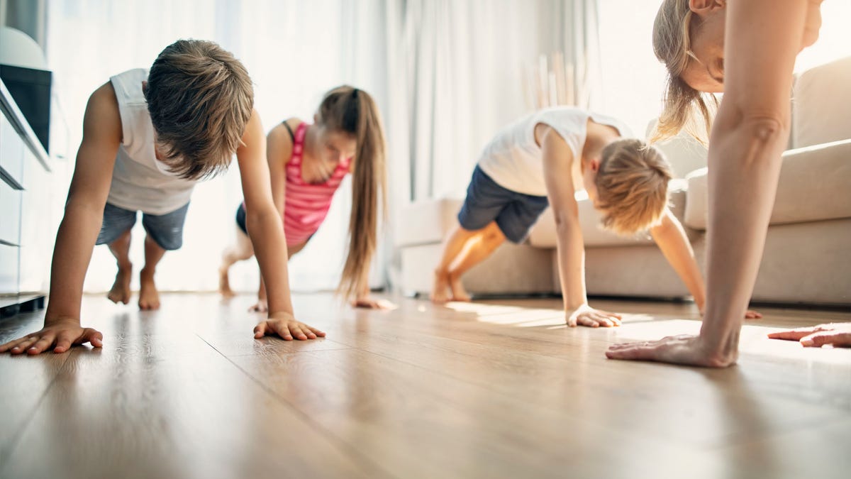 Mother with kids exercising at home