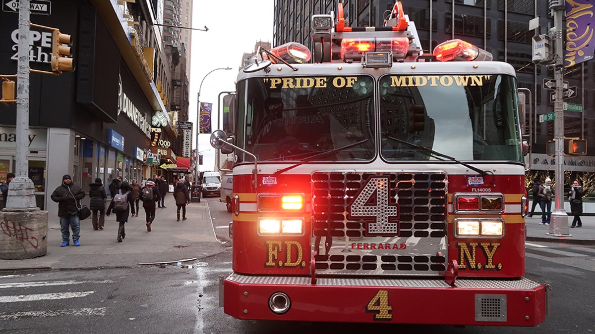 An FDNY fire engine makes a turn onto Broadway as it speeds to a call on November 28, 2018, in New York City. (Photo by Gary Hershorn/Getty Images)