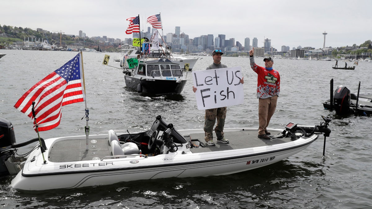 Washington anglers protested by boat on a Seattle lake over the weekend, calling for the state to lift its ban on recreational fishing amid the coronavirus pandemic.(AP Photo/Ted S. Warren)