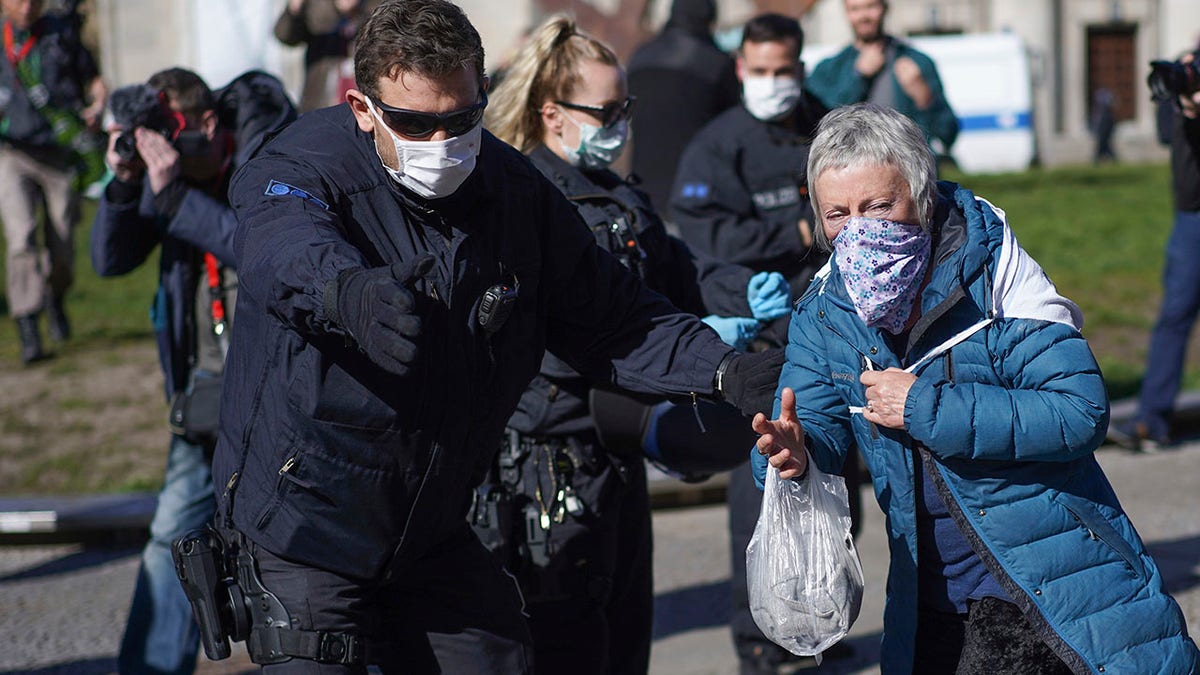 Germany has drafted a plan which will require citizens to wear masks in public if the country's lockdown is lifted on April 19. (Joerg Carstensen/dpa via AP)