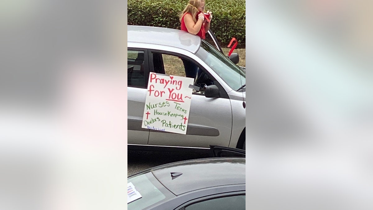 A women's prayer group played worship music and prayed over hospital staff at Memorial Hospital in Gulfport, Mississippi.