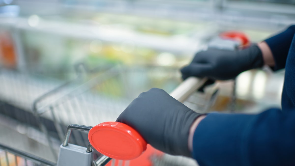 “Wearing gloves if you’re just going to the grocery store isn’t going to be that protective,” one expert told the outlet. (iStock)