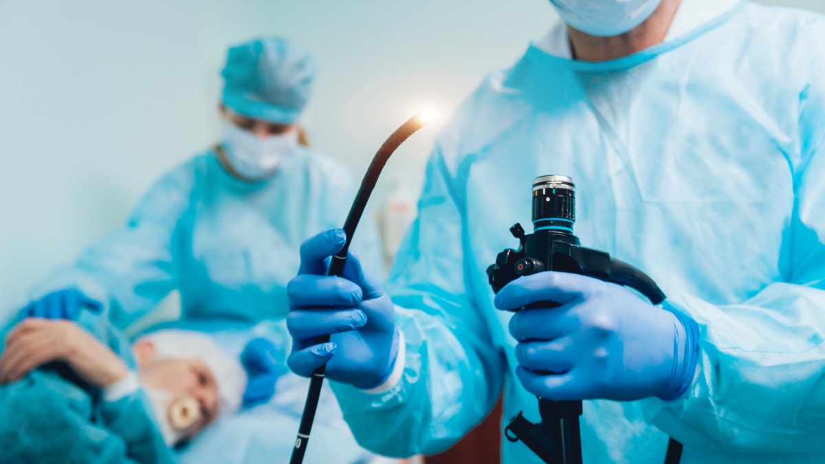 Endoscopy at the hospital. Doctor holding endoscope before gastroscopy