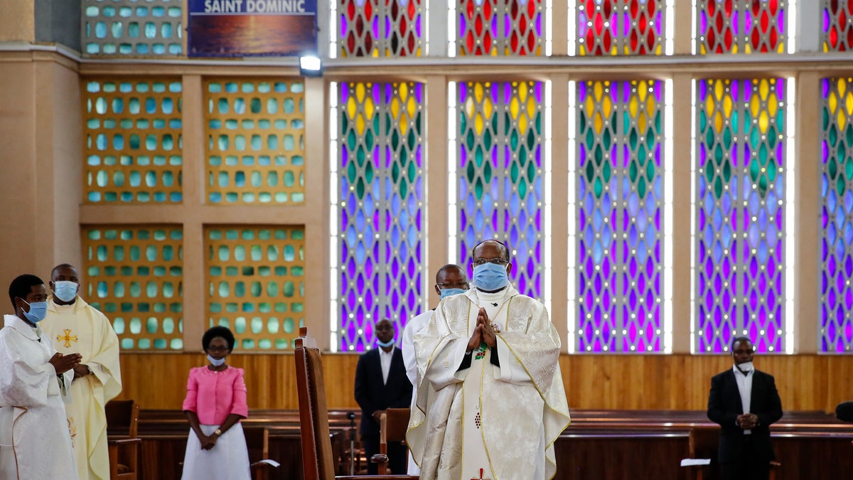 Priests conduct a service without a congregation, but which was broadcast on television, at the Cathedral Basilica of the Holy Family in Nairobi, Kenya, on Easter Sunday. (AP)