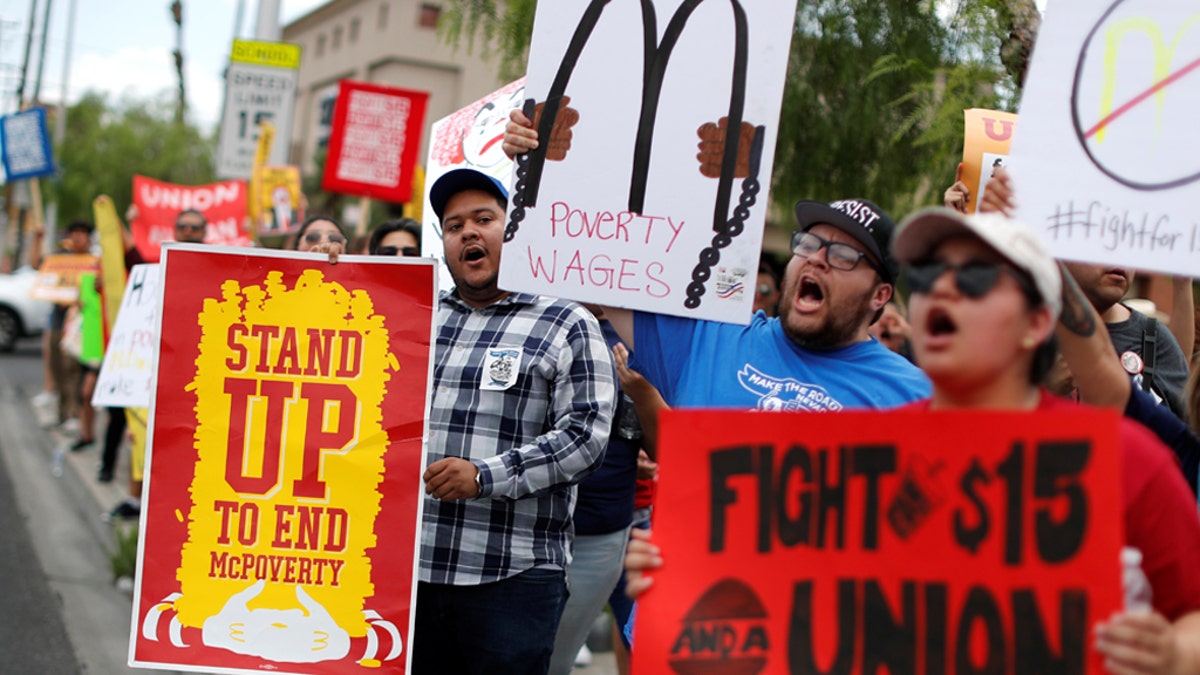 Striking McDonalds workers demanding a $15 minimum wage demonstrate in Las Vegas, Nevada U.S., June 14, 2019.A bill from Sen. Tom Cotton, R-Ark., would increase the minimum wage to $10 and strengthen federal E-verify. REUTERS/Mike Segar - RC1753F868A0