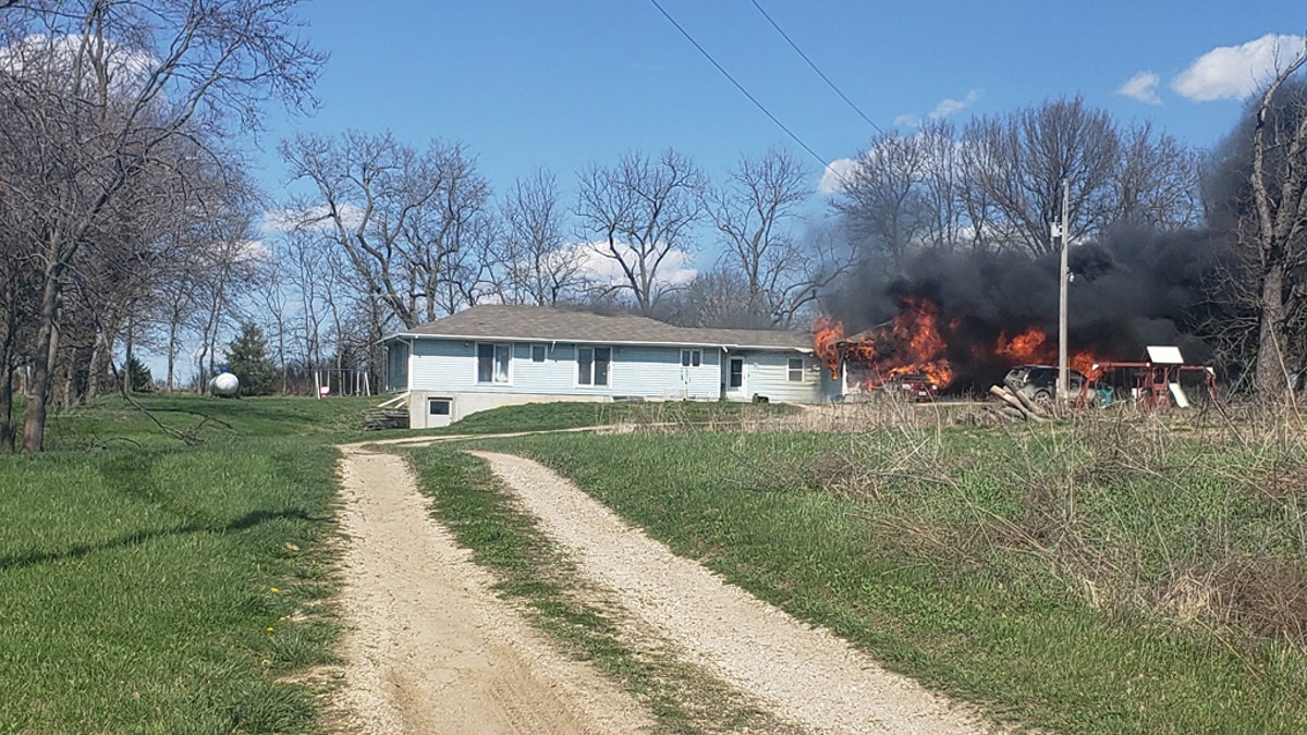 The Villegas family's home burning down in Odessa, Mo., on Sunday. The family lost everything in the fire but their town rallied together to help them.