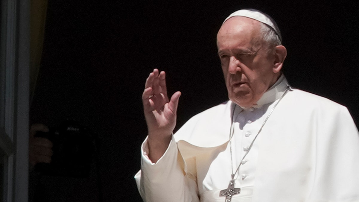 Pope Francis delivers his blessing from the window of his studio overlooking an empty St. Peter's Square, due to anti-coronavirus lockdown measures, at the Vatican, April 26. (AP Photo/Andrew Medichini)