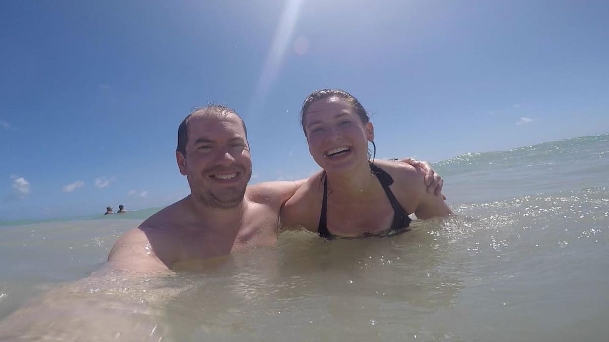 Cassie and Simon Woods in the sea in the Dominican Republic in 2018.