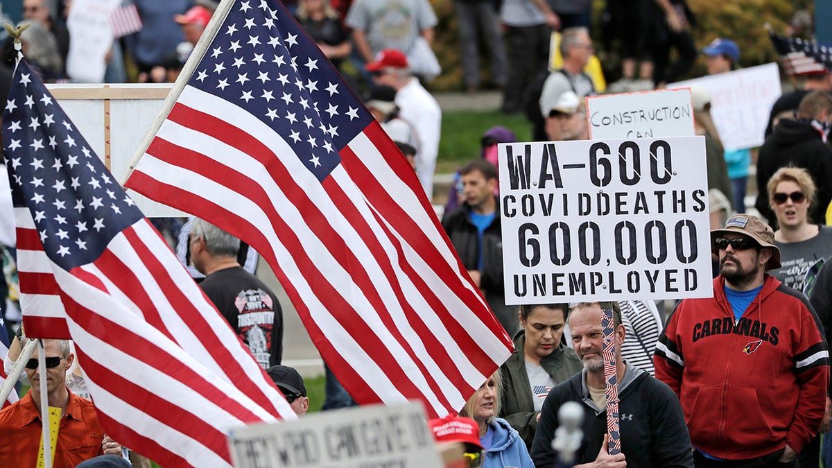 More than 2,000 demonstrators rallied against Inslee's stay-at-home orders. (AP Photo/Elaine Thompson)
