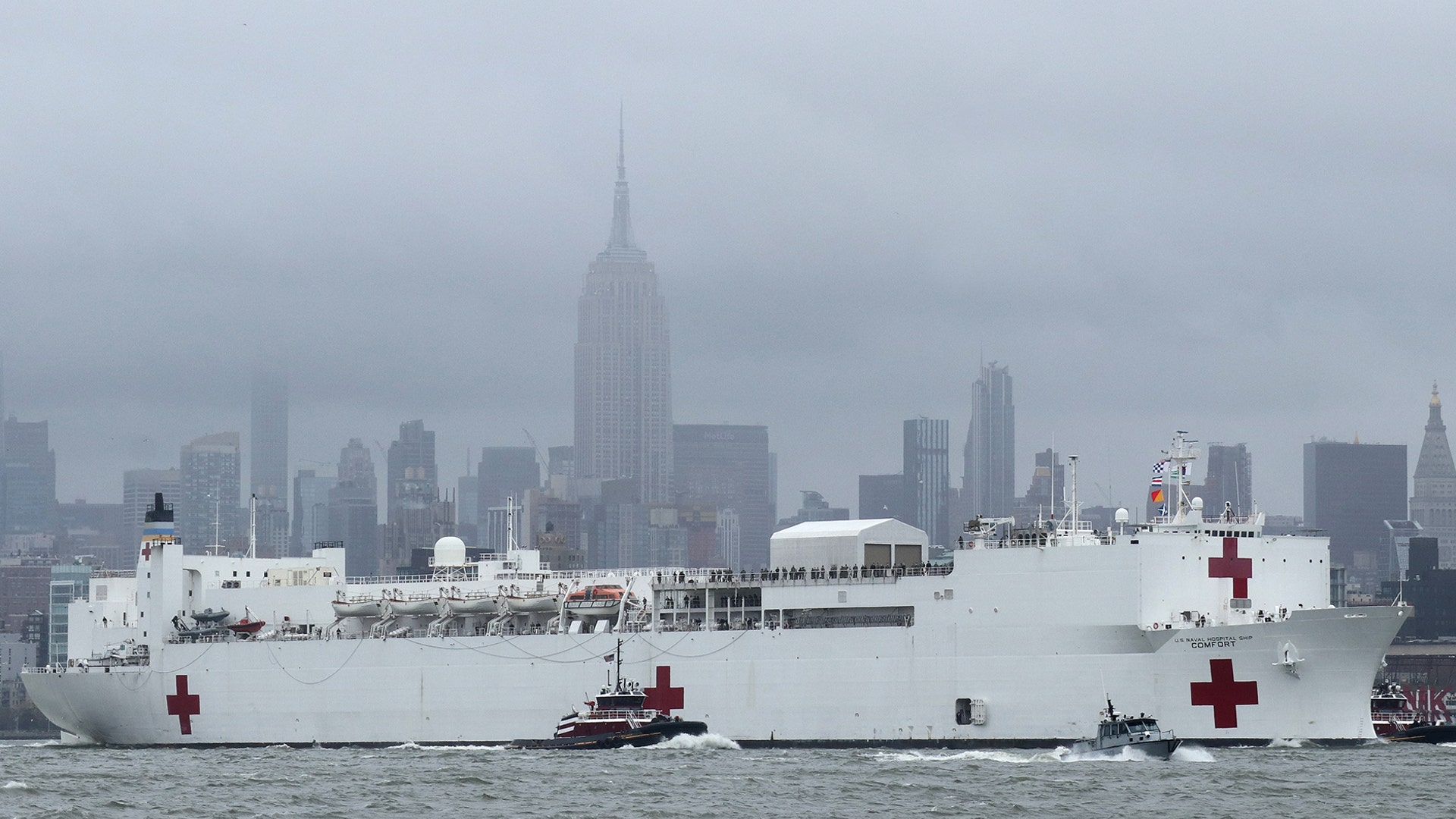 The USNS Comfort hospital ship sails in the Hudson River past the Empire State Building as it departs New York City, April 30, 2020. 