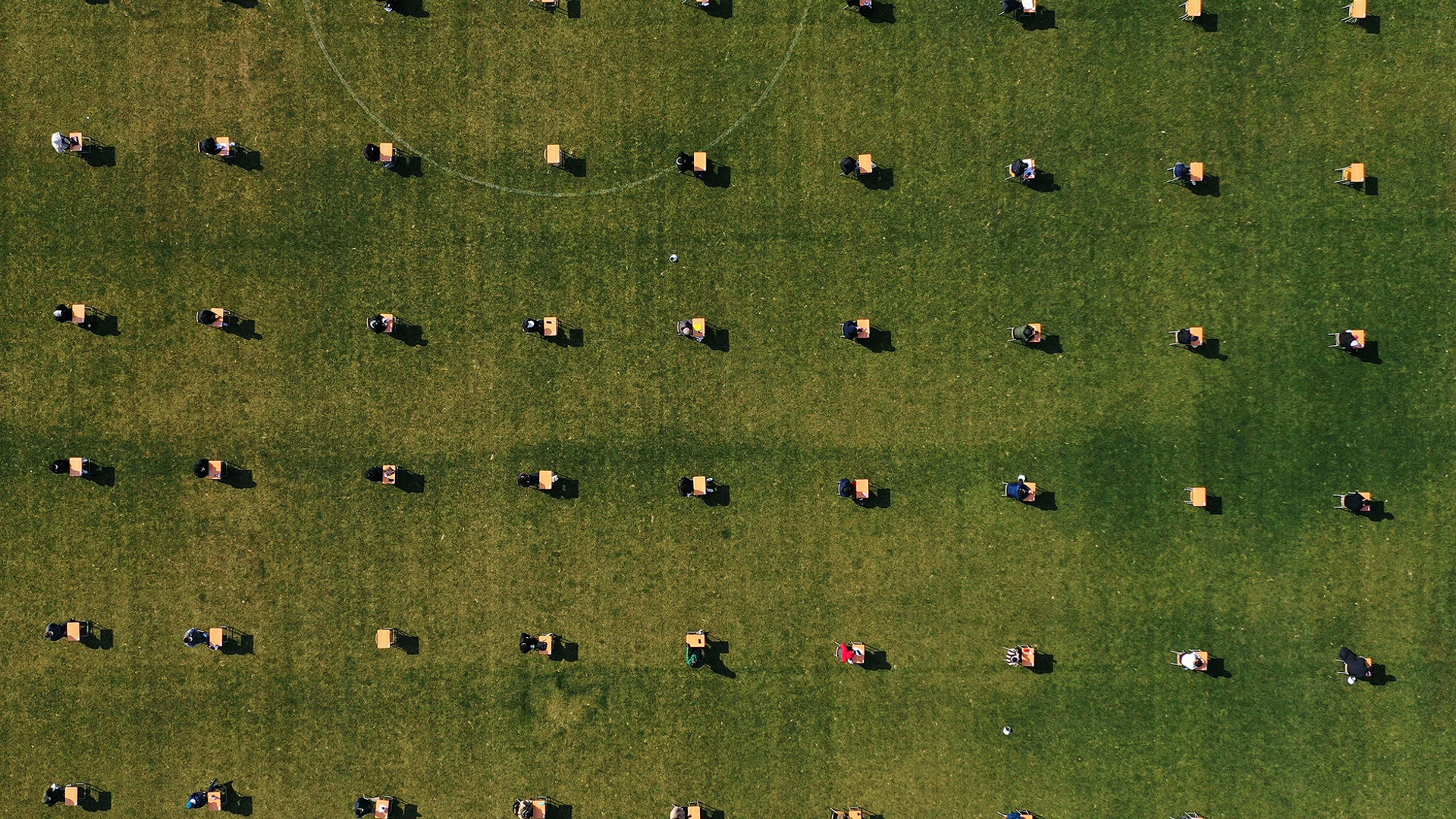 Applicants take the written examination during a recruitment test for Ansan Urban Corporation at the Wa Stadium in Ansan, South Korea, April 4, 2020.