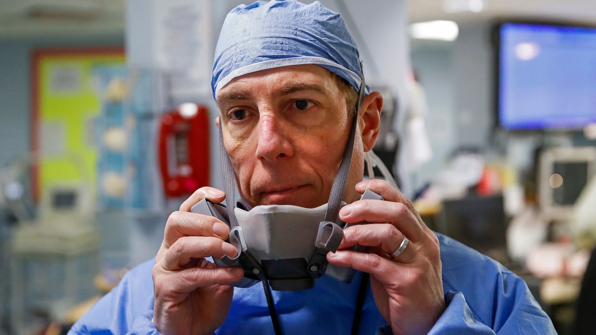 Dr. Anthony Leno, Director of Emergency Medicine, pauses at the end of his shift after his staff revived a patient with COVID-19 who had gone into cardiac arrest, at St. Joseph's Hospital in Yonkers, New York, April 20, 2020.