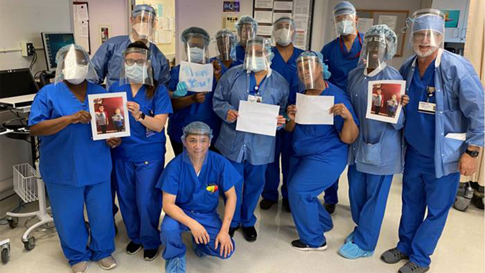 The Operating Room staff at Trinitas Regional Medical Center wear face shields and hold thank-you notes lovingly made by 8-year old Bailey Erez, 10-year old Aaron and their mom, Elena. They are Elizabeth residents and neighbors of Leon Pirak, MD (far right), Chairman of Anesthesia at the Medical Center. The note says it all!