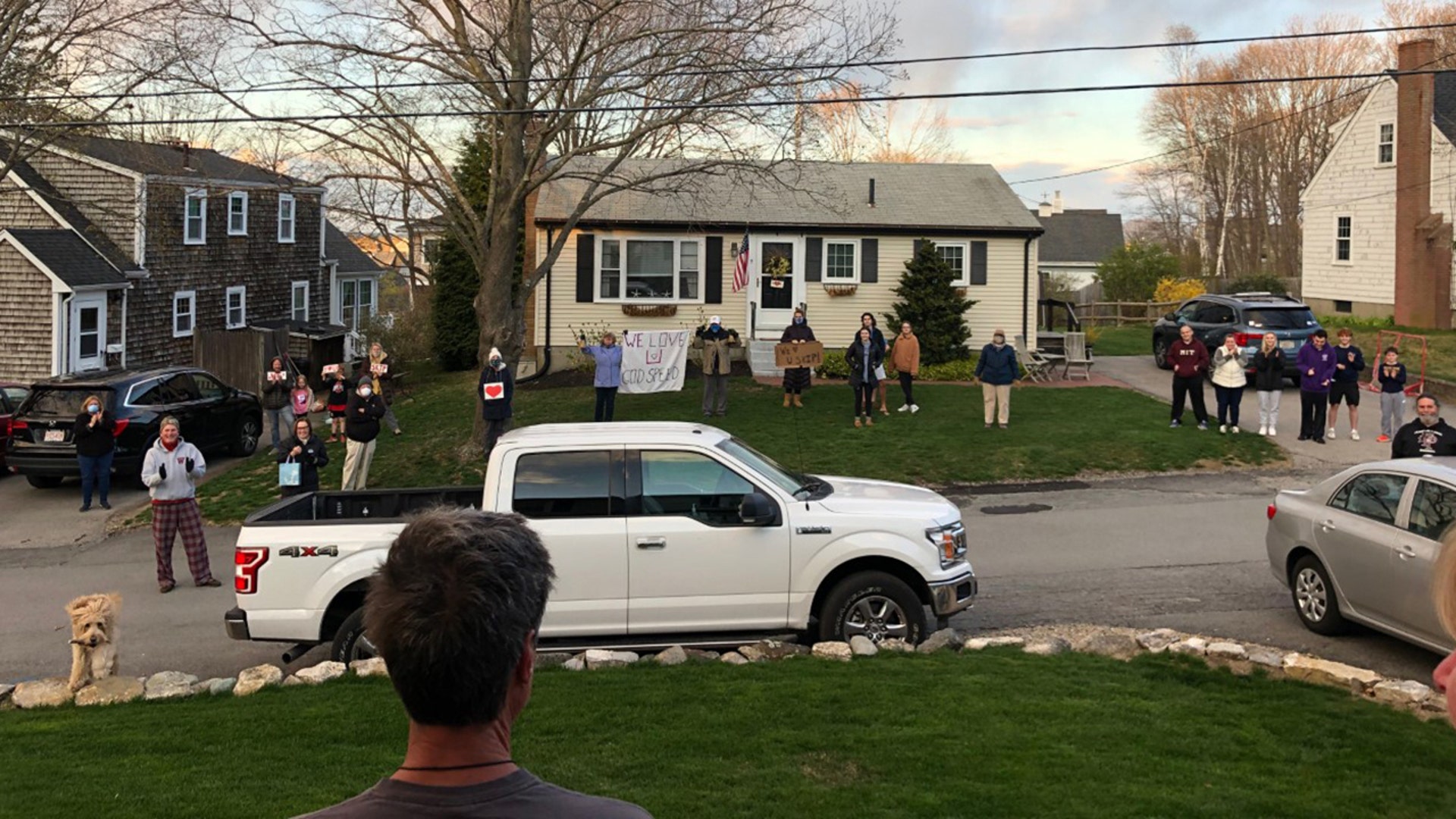Skip Rathje, Scituate, MA, going into his third brain surgery and his neighbors rally around him, socially distanced, to cheer him in his front yard on as he continues to battle brain cancer.