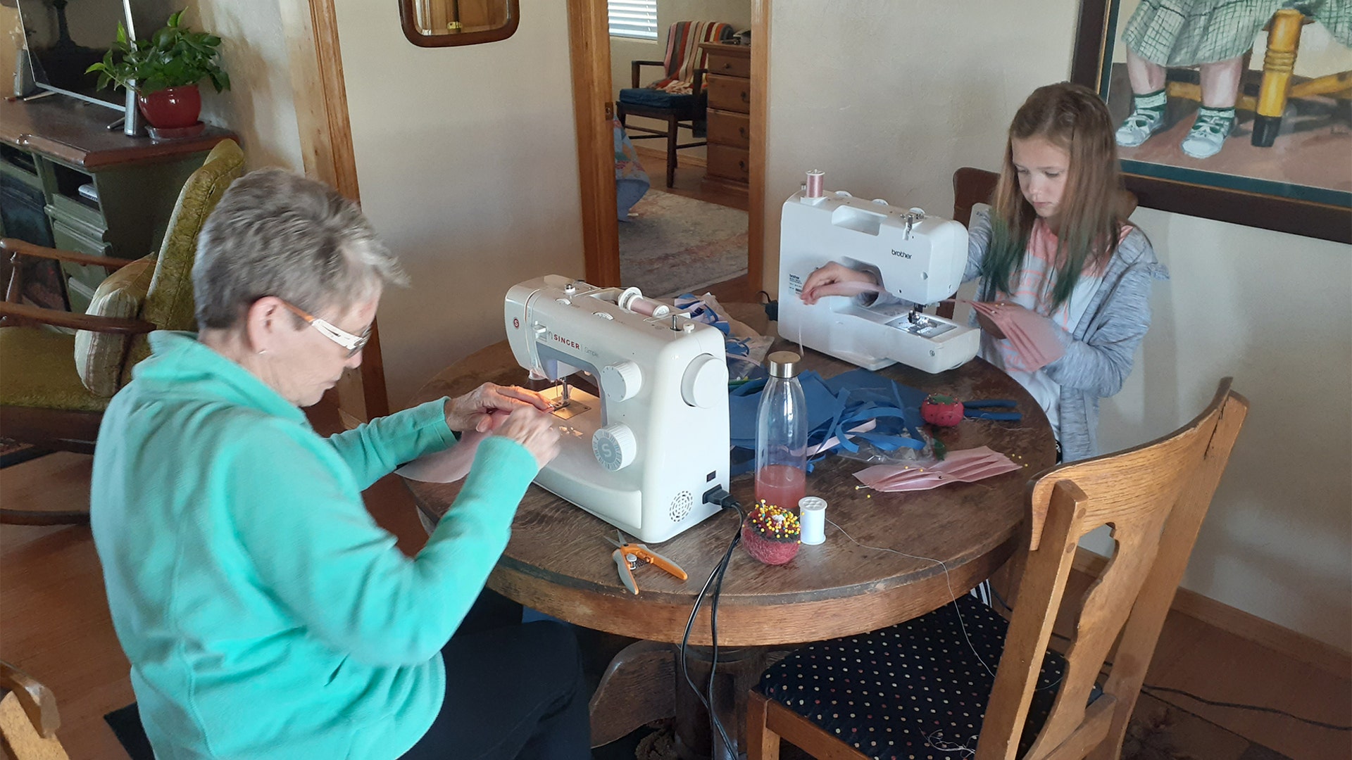 Cindy Owen's (Granny) and (10 year old grand-daughter) Beau Owens sew masks for St.Marys Hospital in Grand Junction, Colorado with others from the Fruita 2nd. Ward of the Church of Jesus Christ of Latter Day Saints.